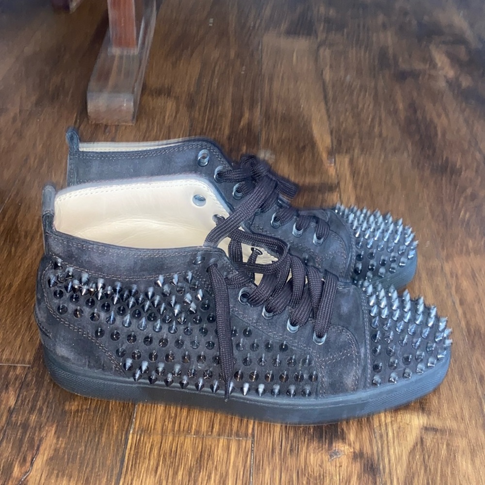 Slightly worn Christian Louboutin. Classic spikes in black!